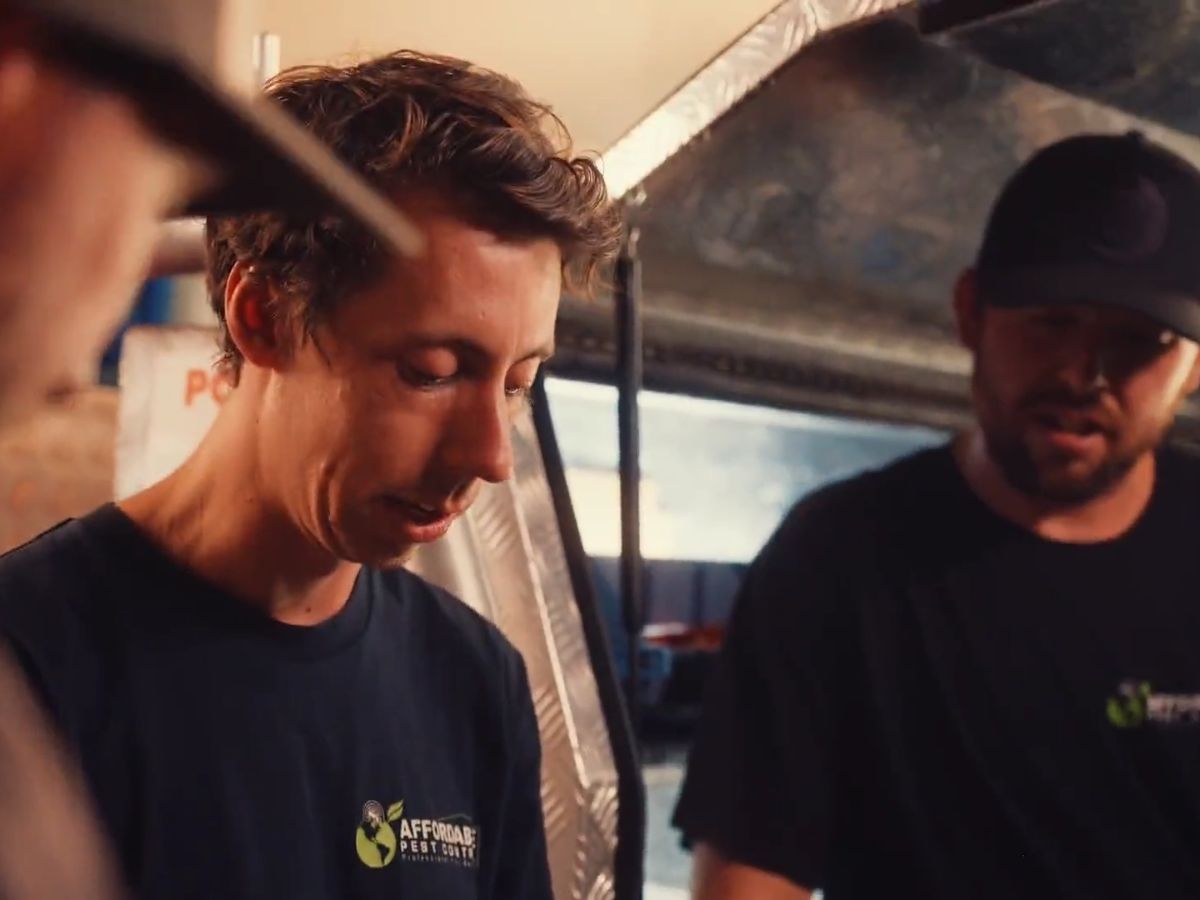 Licensed pest control technicians preparing equipment before a job